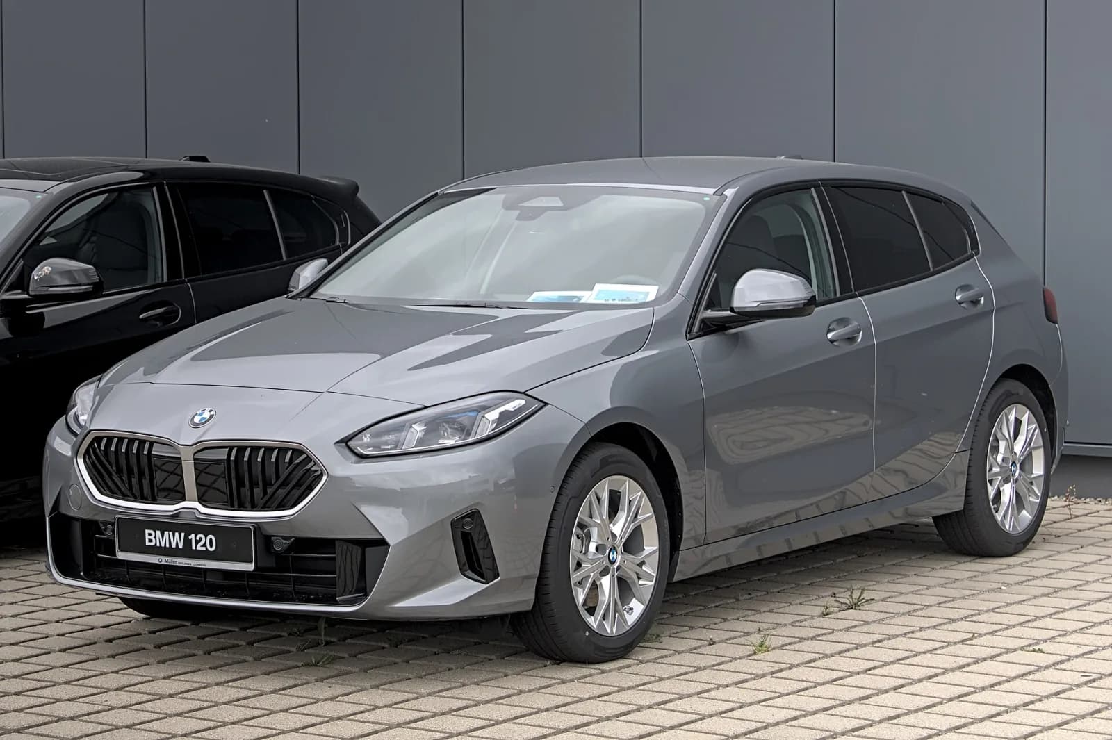 Grey BMW 1 Series (F70, 120) hatchback, front three-quarter view